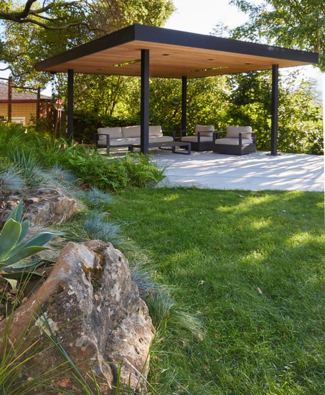 Outdoor living pergola with seating